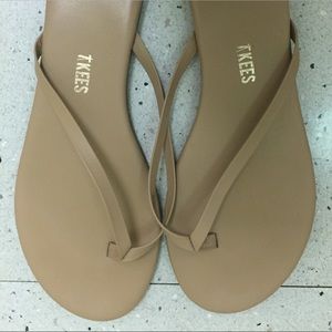 Tkees sand colored flip flops size 7